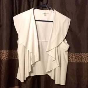 White vest like top would be very cute layered with a long or short sleeve top